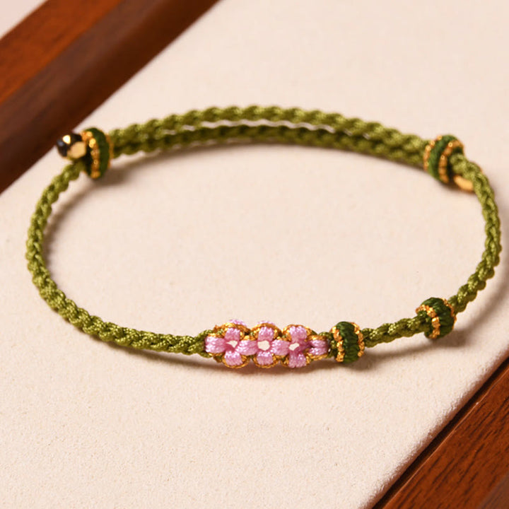 Braccialetto di corda intrecciata con protezione in fiore di pesco fatto a mano Buddha Stones