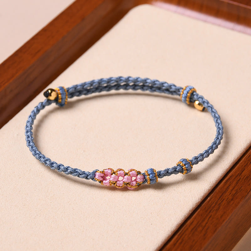 Braccialetto di corda intrecciata con protezione in fiore di pesco fatto a mano Buddha Stones