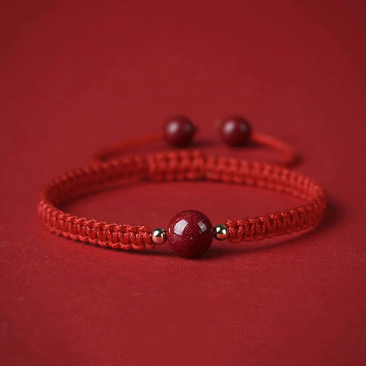 Braccialetto con cordino rosso e perline di cinabro fortunato Buddha Stones