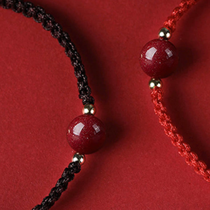 Braccialetto con cordino rosso e perline di cinabro fortunato Buddha Stones