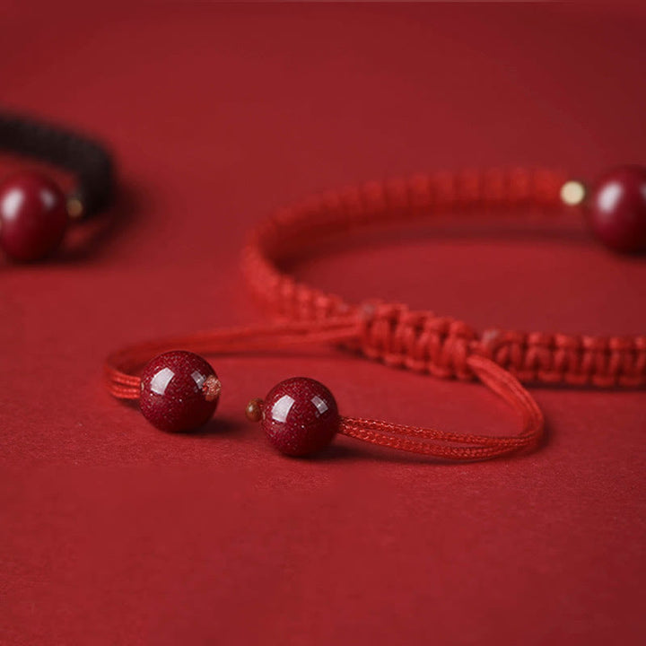Braccialetto con cordino rosso e perline di cinabro fortunato Buddha Stones