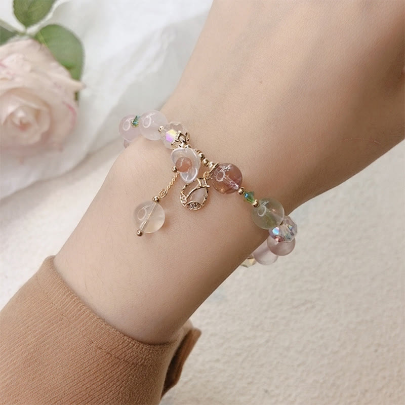 Braccialetto di guarigione con fiori di fluorite, quarzo fragola, quarzo rutilato Buddha Stones