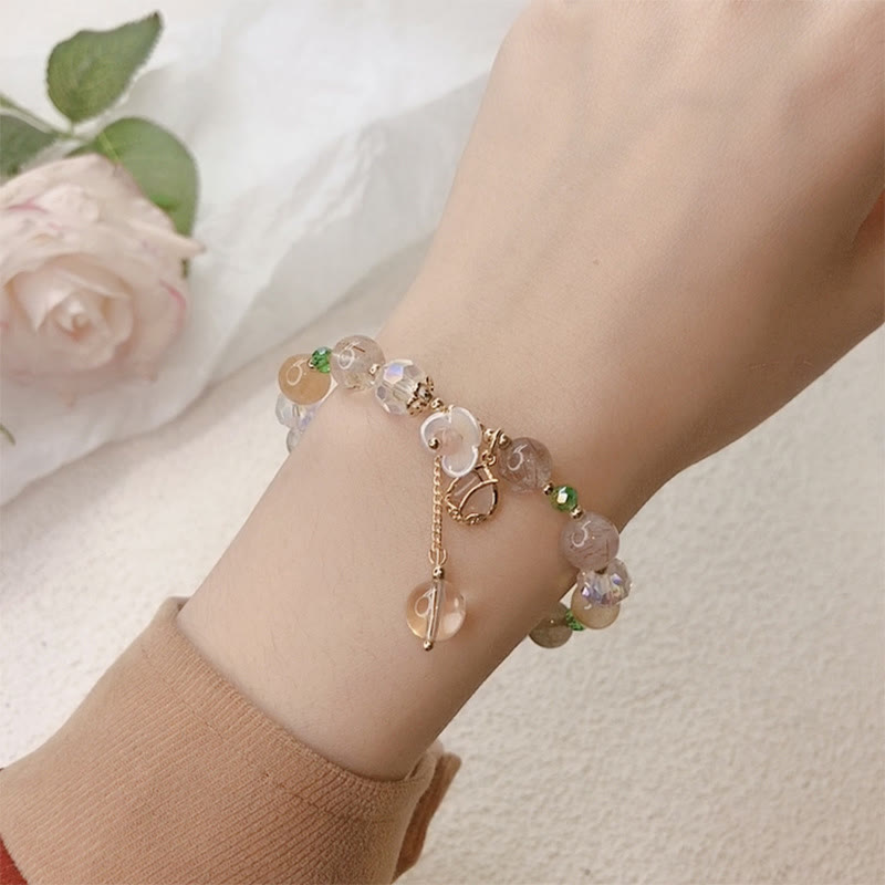 Braccialetto di guarigione con fiori di fluorite, quarzo fragola, quarzo rutilato Buddha Stones