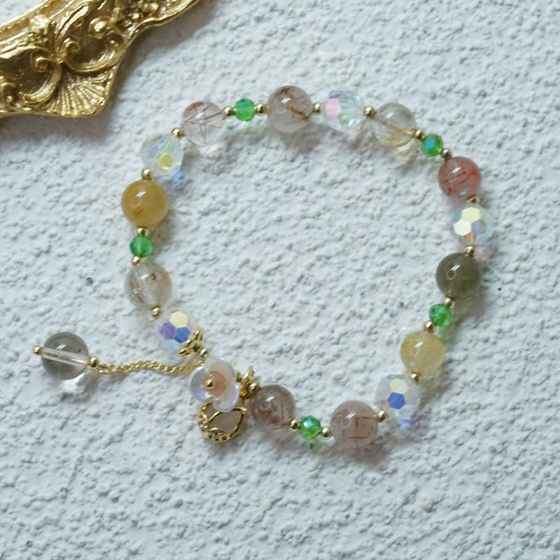 Braccialetto di guarigione con fiori di fluorite, quarzo fragola, quarzo rutilato Buddha Stones