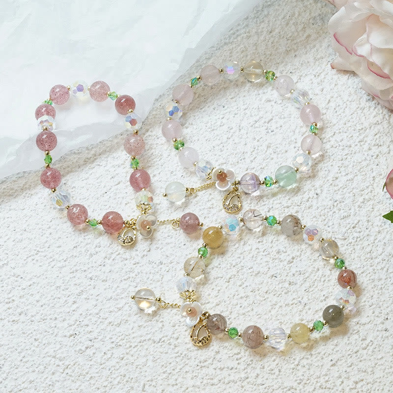 Braccialetto di guarigione con fiori di fluorite, quarzo fragola, quarzo rutilato Buddha Stones