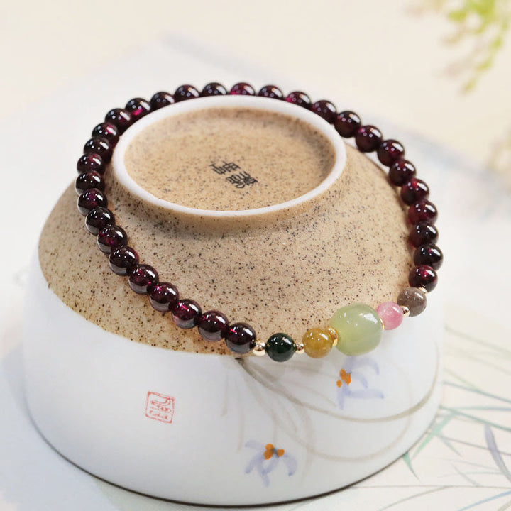 Braccialetto della passione con perline di giada e tormalina naturale di granato e Buddha Stones