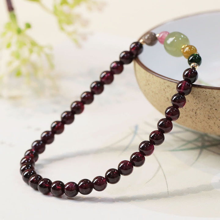 Braccialetto della passione con perline di giada e tormalina naturale di granato e Buddha Stones