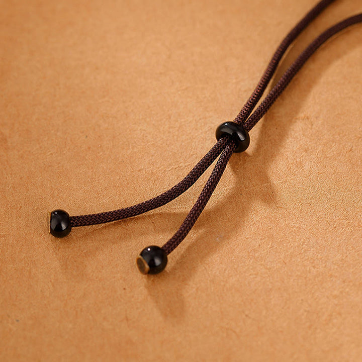 Collana con ciondolo in corda con incisione Om Mani Padme Hum in argento sterling 999 Buddha Stones