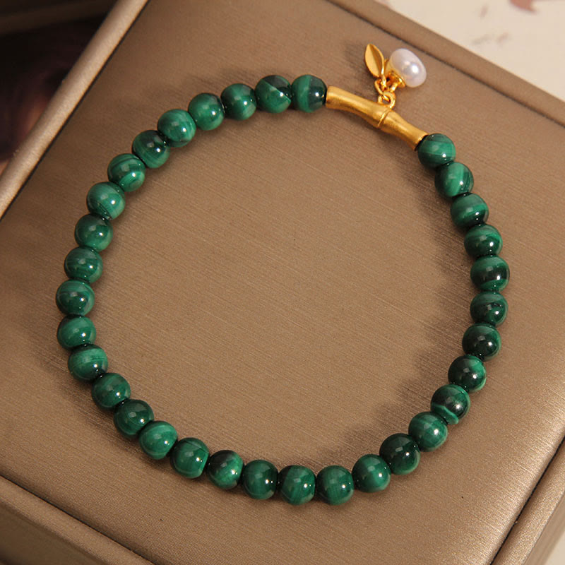 Bracciale anti-ansia in bambù portafortuna con perle di malachite naturale Buddha Stones - image 1