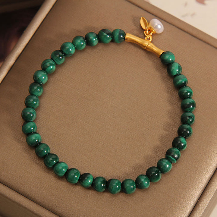 Bracciale anti-ansia in bambù portafortuna con perle di malachite naturale Buddha Stones - image 1