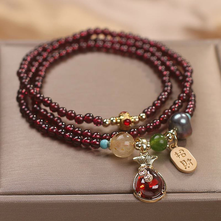 Braccialetto di protezione della ricchezza con monete di granato naturale multistrato in Buddha Stones giada
