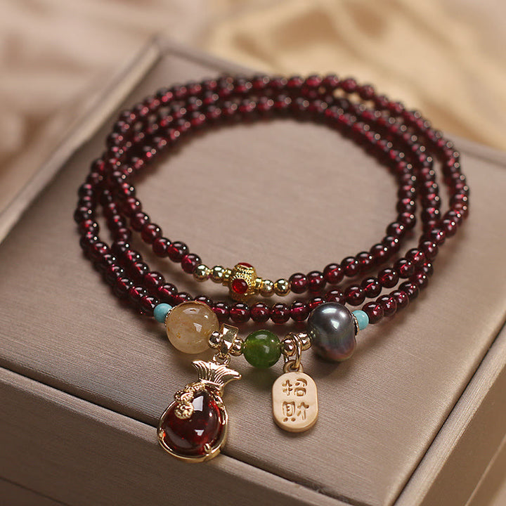 Braccialetto di protezione della ricchezza con monete di granato naturale multistrato in Buddha Stones giada