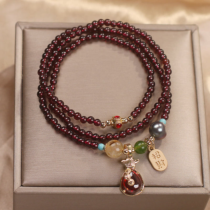Braccialetto di protezione della ricchezza con monete di granato naturale multistrato in Buddha Stones giada