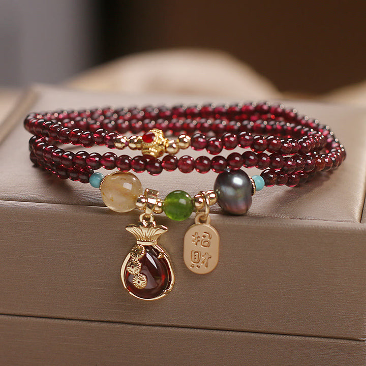 Braccialetto di protezione della ricchezza con monete di granato naturale multistrato in Buddha Stones giada