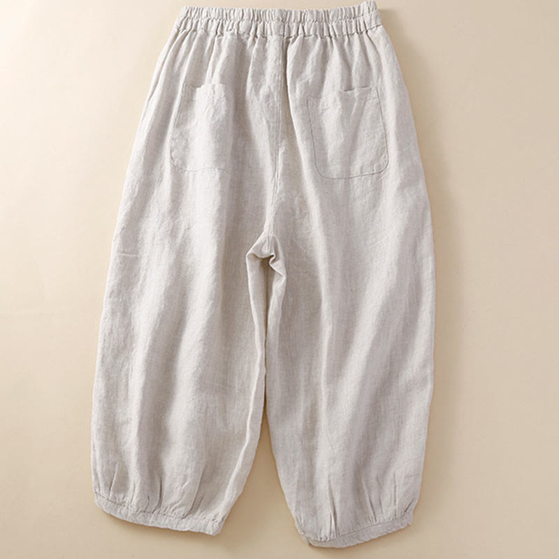 Pantaloni harem larghi con coulisse e tasche, tinta unita, con motivo floreale Buddha Stones. - image 1
