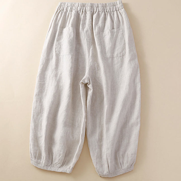 Pantaloni harem larghi con coulisse e tasche, tinta unita, con motivo floreale Buddha Stones. - image 1