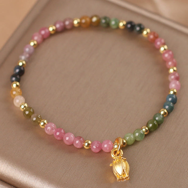 Braccialetto positivo con fiori di tormalina colorata Buddha Stones