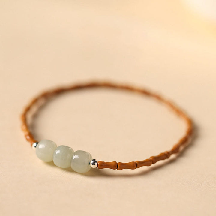 Buddha Stones Braccialetto portafortuna con perline di giada Hetian con motivo in bambù e noccioli di oliva naturali