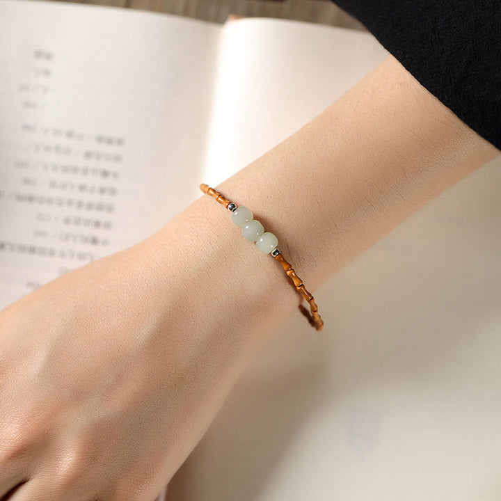 Buddha Stones Braccialetto portafortuna con perline di giada Hetian con motivo in bambù e noccioli di oliva naturali