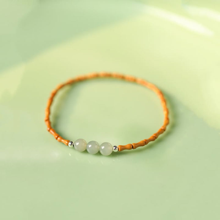 Buddha Stones Braccialetto portafortuna con perline di giada Hetian con motivo in bambù e noccioli di oliva naturali