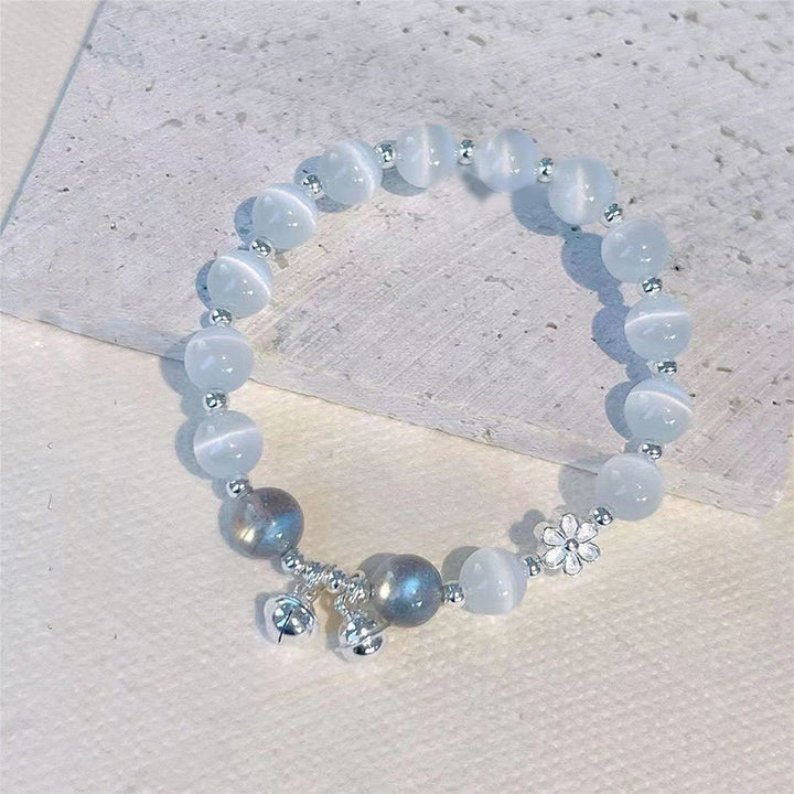 Braccialetto di supporto con ciondolo a forma di carattere Fu con campanella in fiore di pesco e cristalli occhio di gatto Buddha Stones