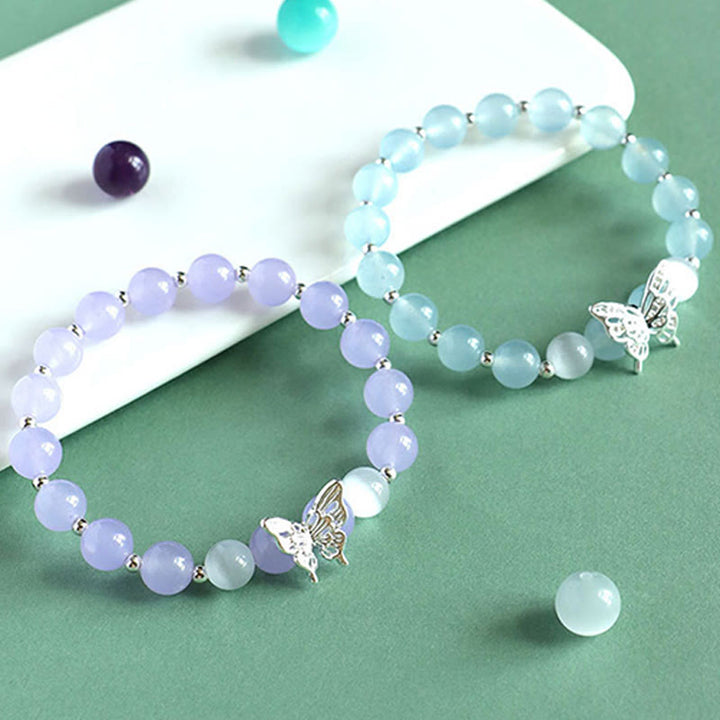 Braccialetto energetico a farfalla in calcedonio blu, cristallo rosa e calcedonio viola Buddha Stones