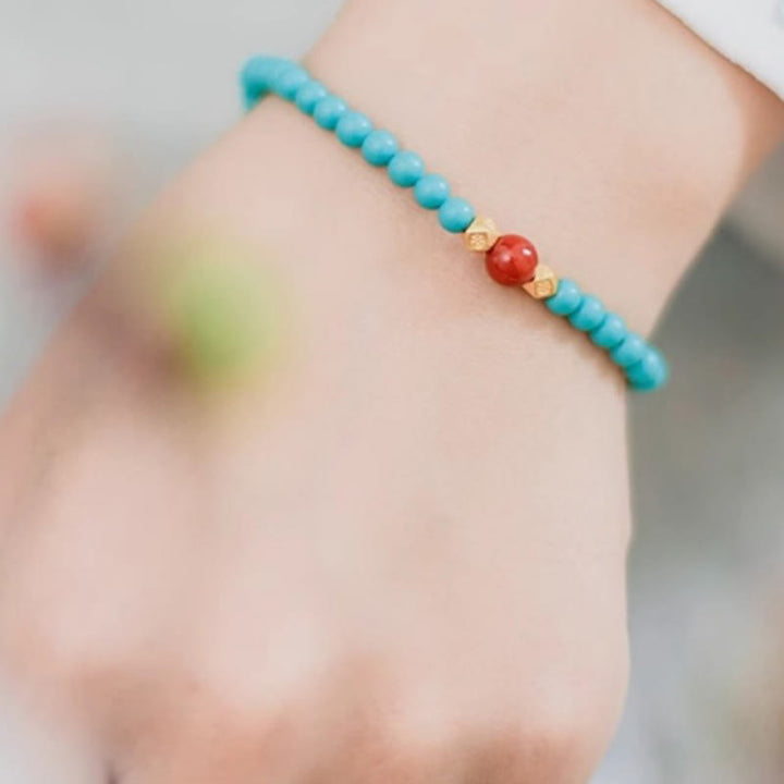 Braccialetto di protezione con perline di agata rossa e turchese Buddha Stones