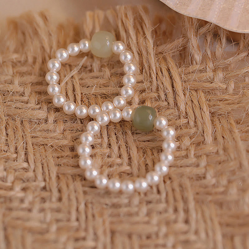 Anello portafortuna con perle di giada rotonde e Buddha Stones