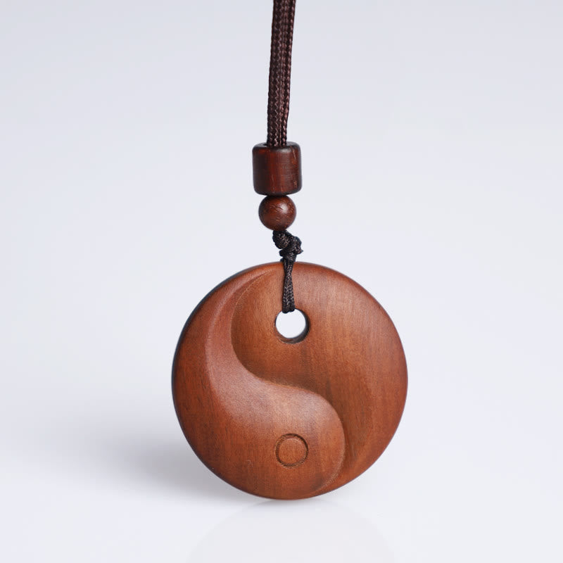 Collana con ciondolo di protezione della fortuna Yin Yang in legno di giuggiola colpito da fulmini Buddha Stones