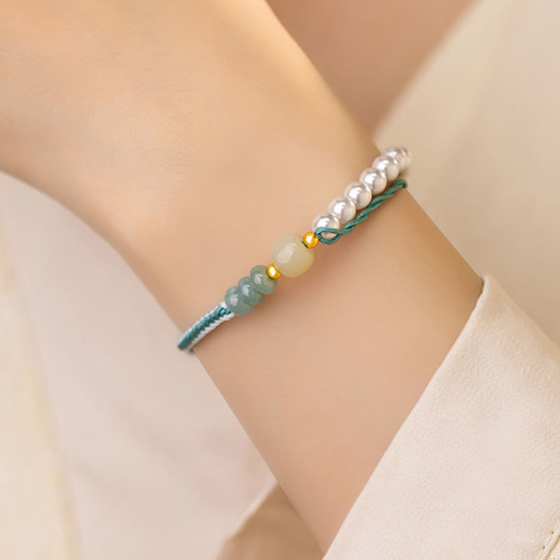 Bracciale Buddha Stones in argento sterling 925 con giada Hetian e corda intrecciata con perle e abbondanza