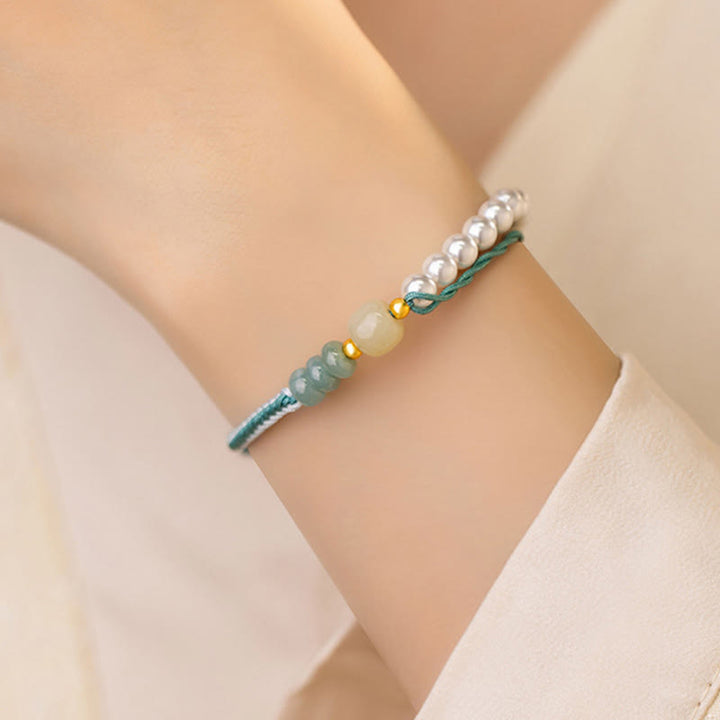 Bracciale Buddha Stones in argento sterling 925 con giada Hetian e corda intrecciata con perle e abbondanza