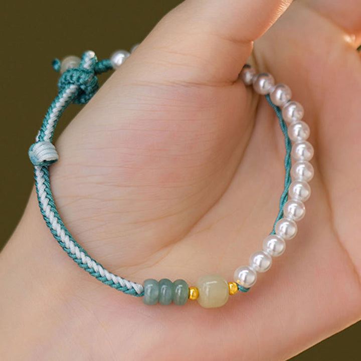 Bracciale Buddha Stones in argento sterling 925 con giada Hetian e corda intrecciata con perle e abbondanza