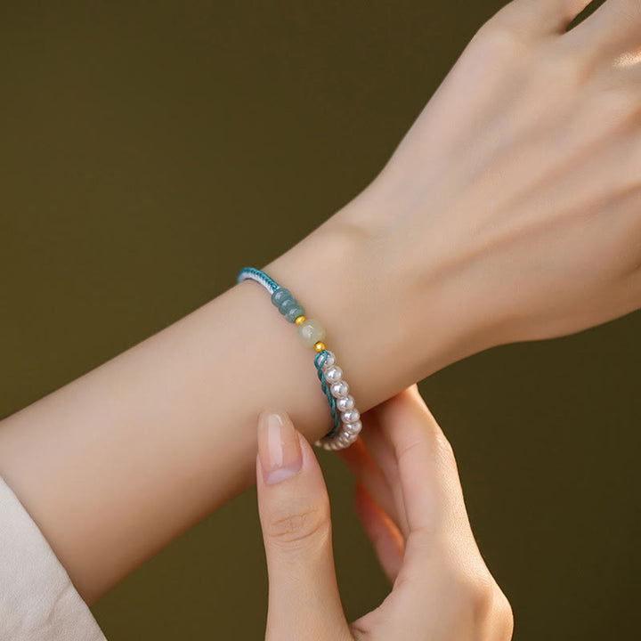Bracciale Buddha Stones in argento sterling 925 con giada Hetian e corda intrecciata con perle e abbondanza