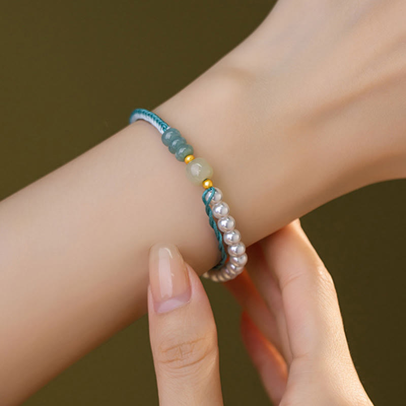 Bracciale Buddha Stones in argento sterling 925 con giada Hetian e corda intrecciata con perle e abbondanza