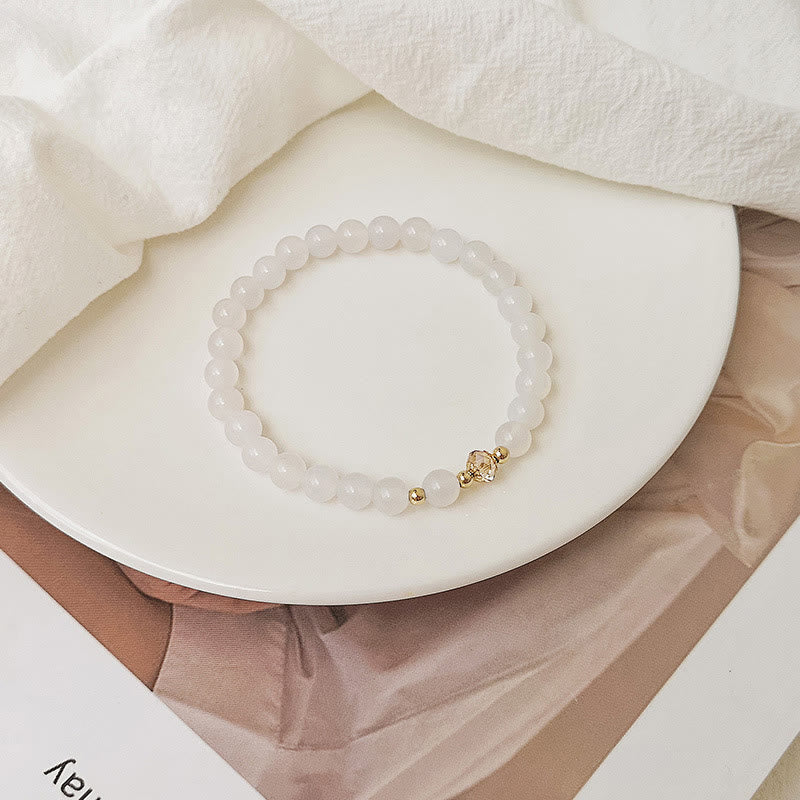 Buddha Stones Braccialetto di guarigione di cristallo blu di acquamarina di rame placcato oro 14K bianco di agata bianca