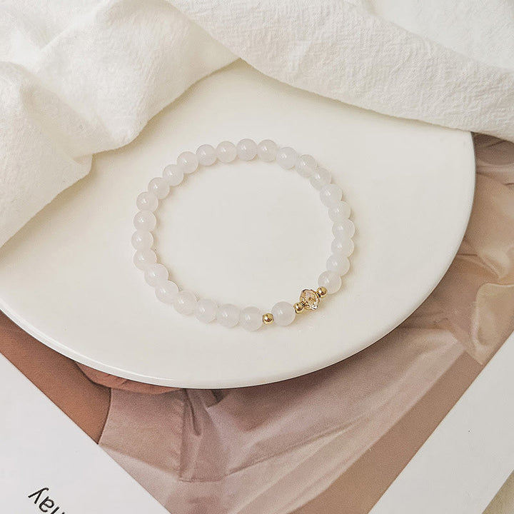 Buddha Stones Braccialetto di guarigione di cristallo blu di acquamarina di rame placcato oro 14K bianco di agata bianca