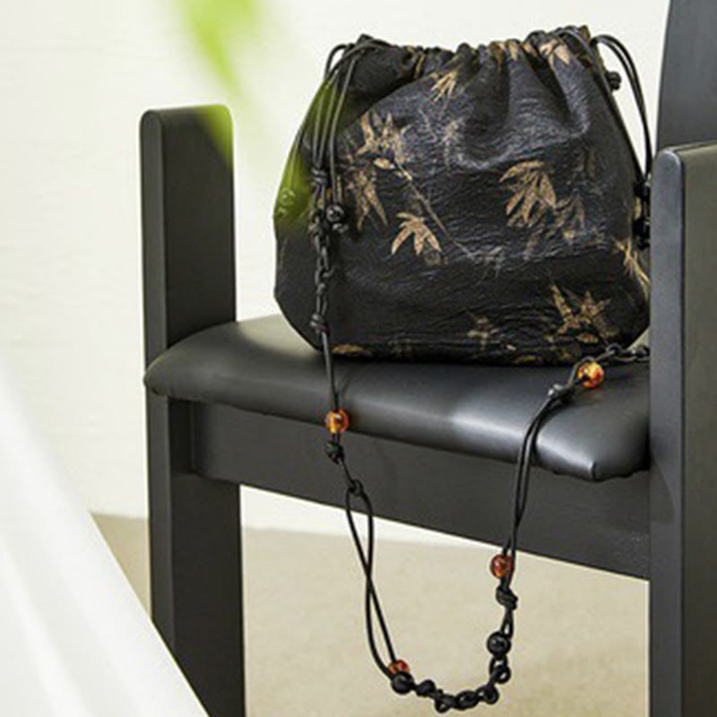 Borsa a tracolla in acetato con motivo a foglie di bambù giallo Buddha Stones