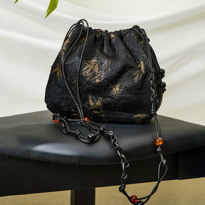 Borsa a tracolla in acetato con motivo a foglie di bambù giallo Buddha Stones