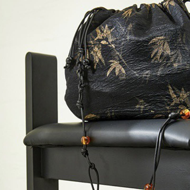 Borsa a tracolla in acetato con motivo a foglie di bambù giallo Buddha Stones