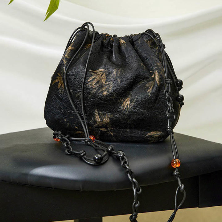 Borsa a tracolla in acetato con motivo a foglie di bambù giallo Buddha Stones