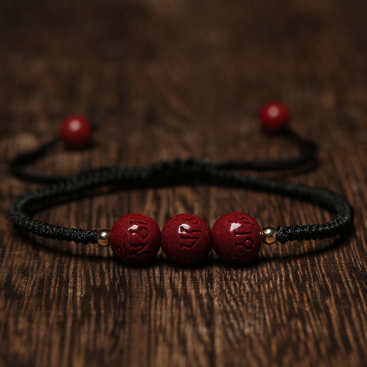 Buddha Stones Cinnabar fatto a mano Om Mani Padme Hum Perline incise Bracciale intrecciato per la benedizione
