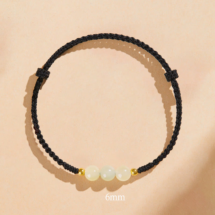 Bracciale intrecciato con perline di giada rotonde fatte a mano con Buddha Stones e portafortuna