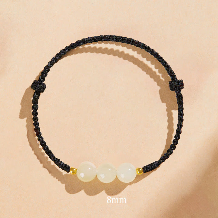 Bracciale intrecciato con perline di giada rotonde fatte a mano con Buddha Stones e portafortuna