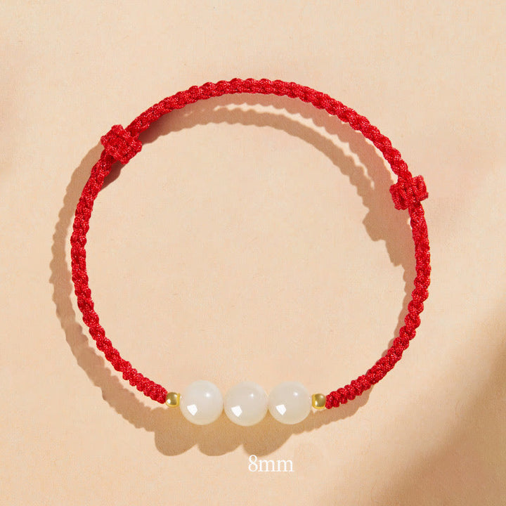 Bracciale intrecciato con perline di giada rotonde fatte a mano con Buddha Stones e portafortuna
