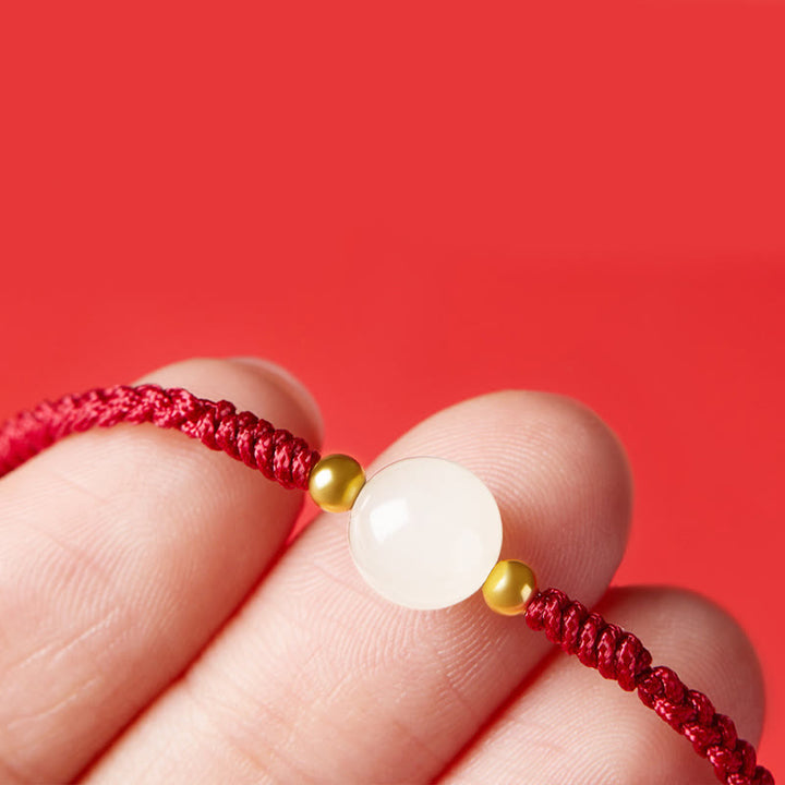 Bracciale intrecciato con perline di giada rotonde fatte a mano con Buddha Stones e portafortuna