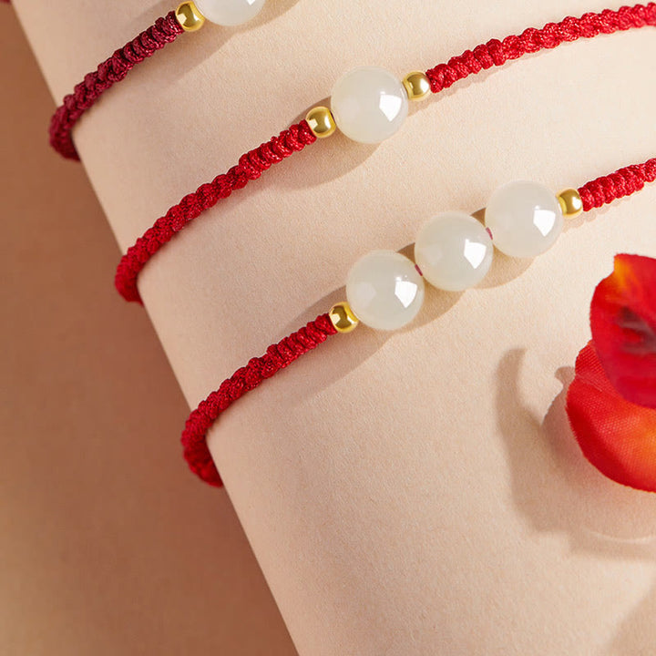 Bracciale intrecciato con perline di giada rotonde fatte a mano con Buddha Stones e portafortuna