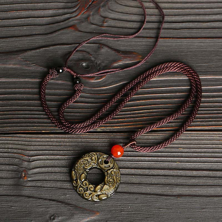 Collana con Buddha Stones in ossidiana, ciondolo in rame, ciondolo in oro ...