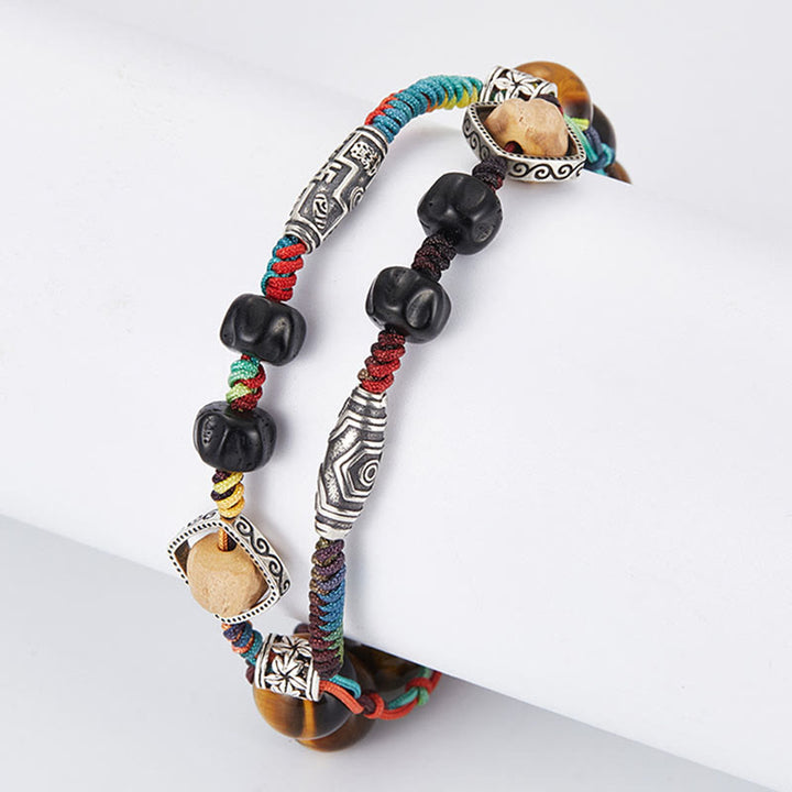 Braccialetto fatto a mano con coraggio Buddha Stones in argento sterling 925 con occhio di tigre e semi di Bodhi