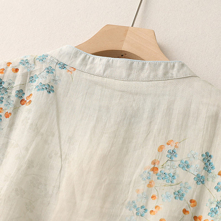 Camicia a maniche a tre quarti con bottoni a forma di rana, fiori blu e pietre di Buddha, foglie arancioni e motivo Buddha Stones. - image 4