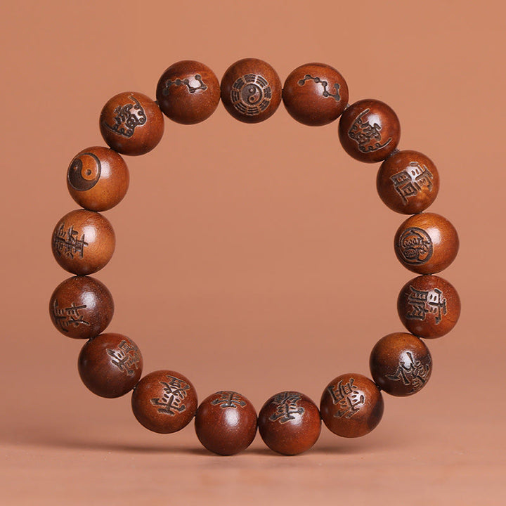Buddha Stones Fulmine Colpito Legno di Giuggiola Yin Yang Bagua Caratteri Tabù Taoisti Braccialetto di Protezione Inciso